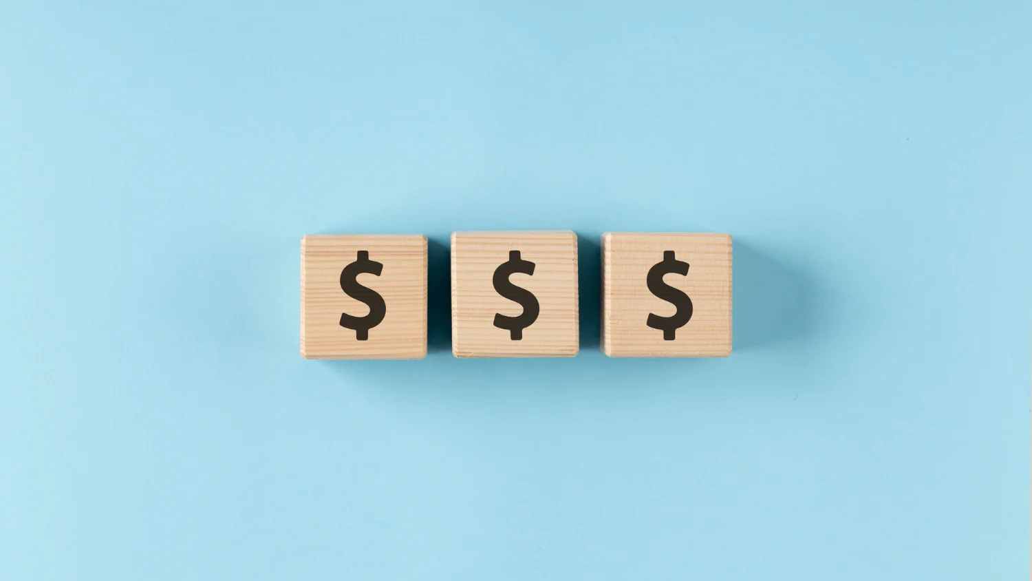 Imagen de dados mostrando iconos de dinero